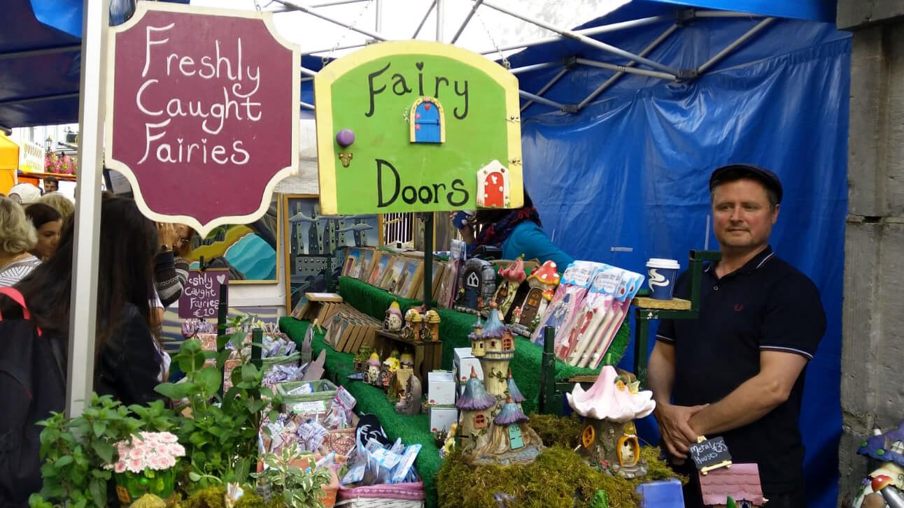 Selling fairy doors at a market in Ireland