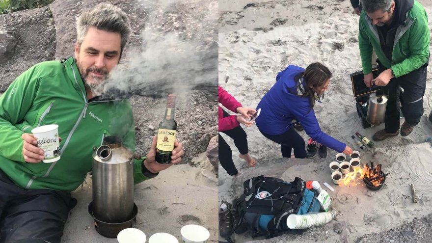 VagaGuide Tim makes a wild irish coffee on a beach with his group in Ireland