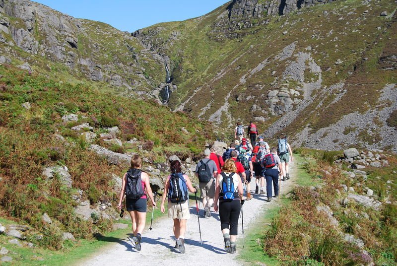 A Vagabond tour group setting off on their hike through the Comeragh mountains in the sunshine 