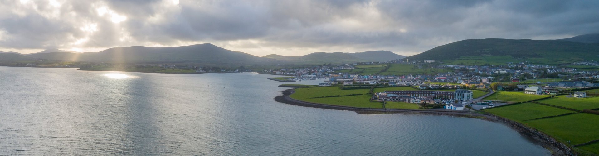 Scenic drone shot of Dingle Bay and Dingle Skellig Hotel in Ireland