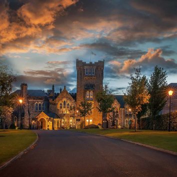 The exterior of the kilronan castle hotel in the sunset