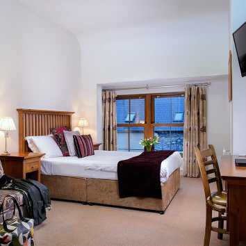 The interior design of a double room in The Coachmans The interior design of a double room in The Coachmans