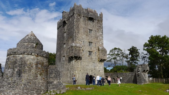 Group taking tour of Aughnanure Castle during Wild Atlantic Way tour of Ireland