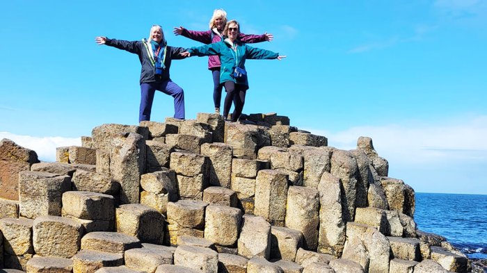 Walking in the footsteps of Irish giants at the Giant's Causeway in Northern Ireland Our guests walking in the footsteps of giants at the Gian's Causeway in Northern Ireland