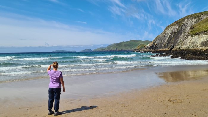 Taking a moment to take it all in on the amazing Slea Head Drive Soaking up the sunshine and enjying the views from Coumeenole Beach on Slea Head, Co. Kerry