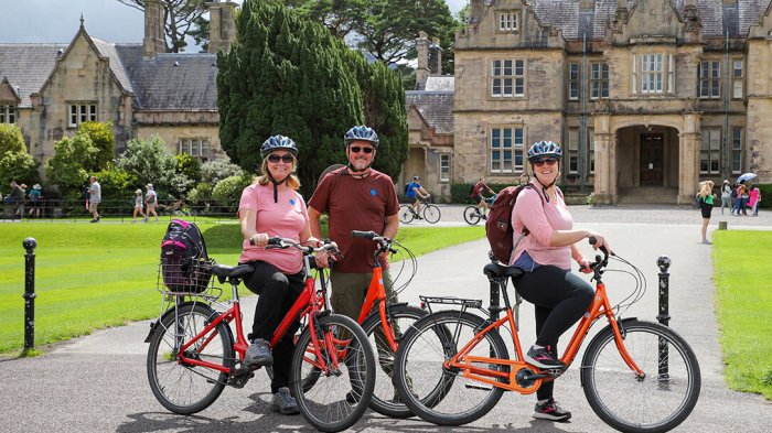 Smiling guests embark on a two-wheeled adventure through Killarney National Park Smiles all-round cycling through Killarney National Park